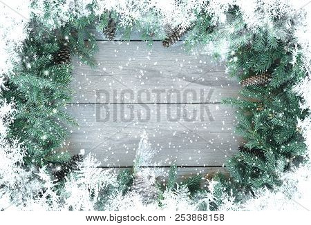 Christmas Firbranch With Cones On Old Wooden Rustic Background With Copy Space For Text, Toned