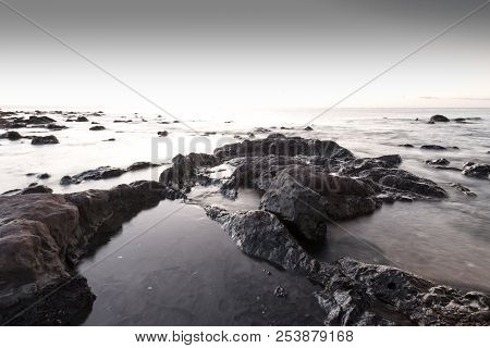 Moody Sunrise At Palmasera Beach In Cala Gonone On The Italian Island Of Sardinia