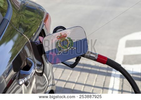 Fueling Car With Petrol Pump At A Gas Station.