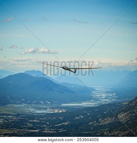 A Duodiscus Glider Flying In The Mountains Of The Columbia Valley Near Invermere, East Kootenay, Bri