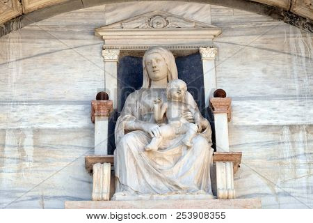 VERONA, ITALY - MAY 27: Virgin Mary with baby Jesus, statue on the facade of Palazzo del Vescovado, Verona Diocesan Palace, Italy, on May 27, 2017.