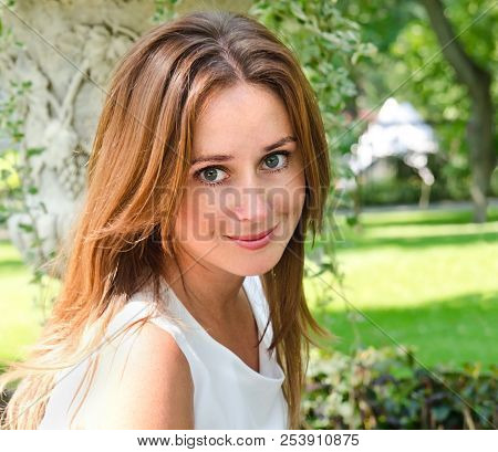 Portrait Of Prety Smiling Young Woman Outdoors In Summer Day
