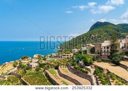 Village Of Banyalbufar On Balearic Island Of Mallorca, Spain On Beautiful Summer Day Against Blue Se
