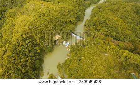 Aerial View, River In The Rainforest Among The Jungle Tropical Loboc River In The Rain Forest In Asi