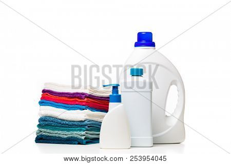 Photo of three bottles of cleansers and colorful towels