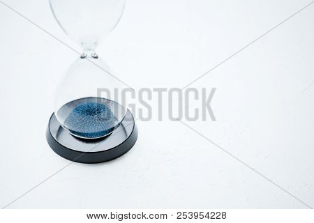 Photo of hourglass on isolated white background