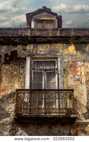 Detail of a window and balcony in an old house ruin