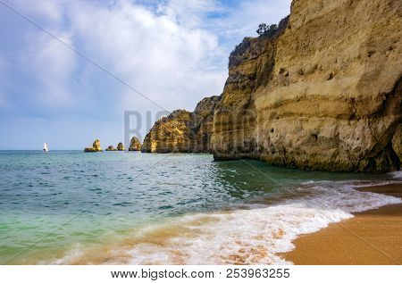 View of the ocean and cliffs in Dona Ana Beach in Lagos, Portugal