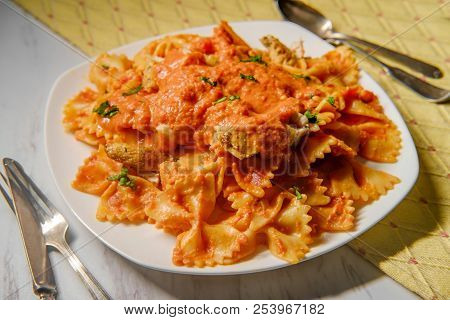 Farfalle Bow Tie Pasta In Creamy Vodka Tomato Sauce With Grilled Chicken And Green Peas
