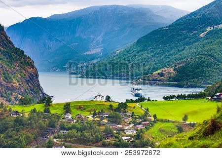 Flam, Norway, Norwegian Fjord Village With Sognefjord Landscape And Cruise Ship
