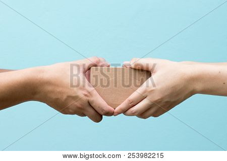 Woman Hand Received The Borwn Box Delivery From Freighter Background With Copy Space
