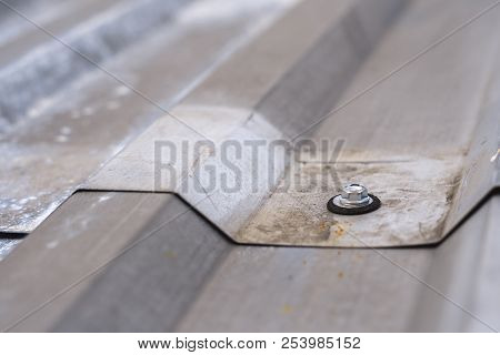 Gray Corrugated Metal Cladding On Industrial Building Roof