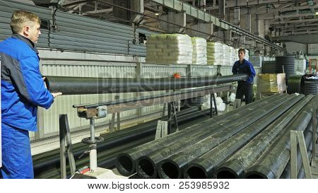 Russia, Angarsk - June 8, 2018: Sawmill Circular Saw Machine. Manufacture Of Plastic Water Pipes Fac