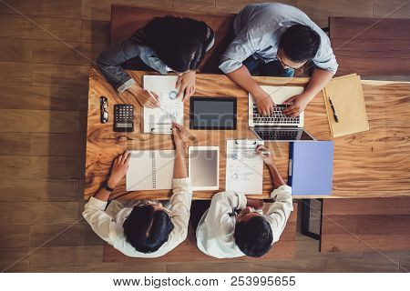 Asian Business People Meeting With New Startup Project Pointing Graph Discussion And Analysis Data C