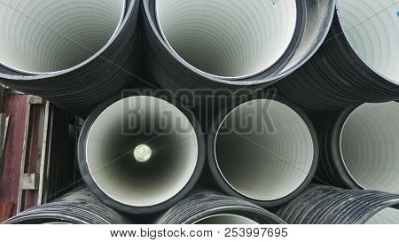 Warehouse Of Finished Plastic Pipes Industrial Outdoors Storage Site. Manufacture Of Plastic Water P