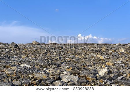 Deserted Flat Gravelly Rocky Terrain Under The Sky