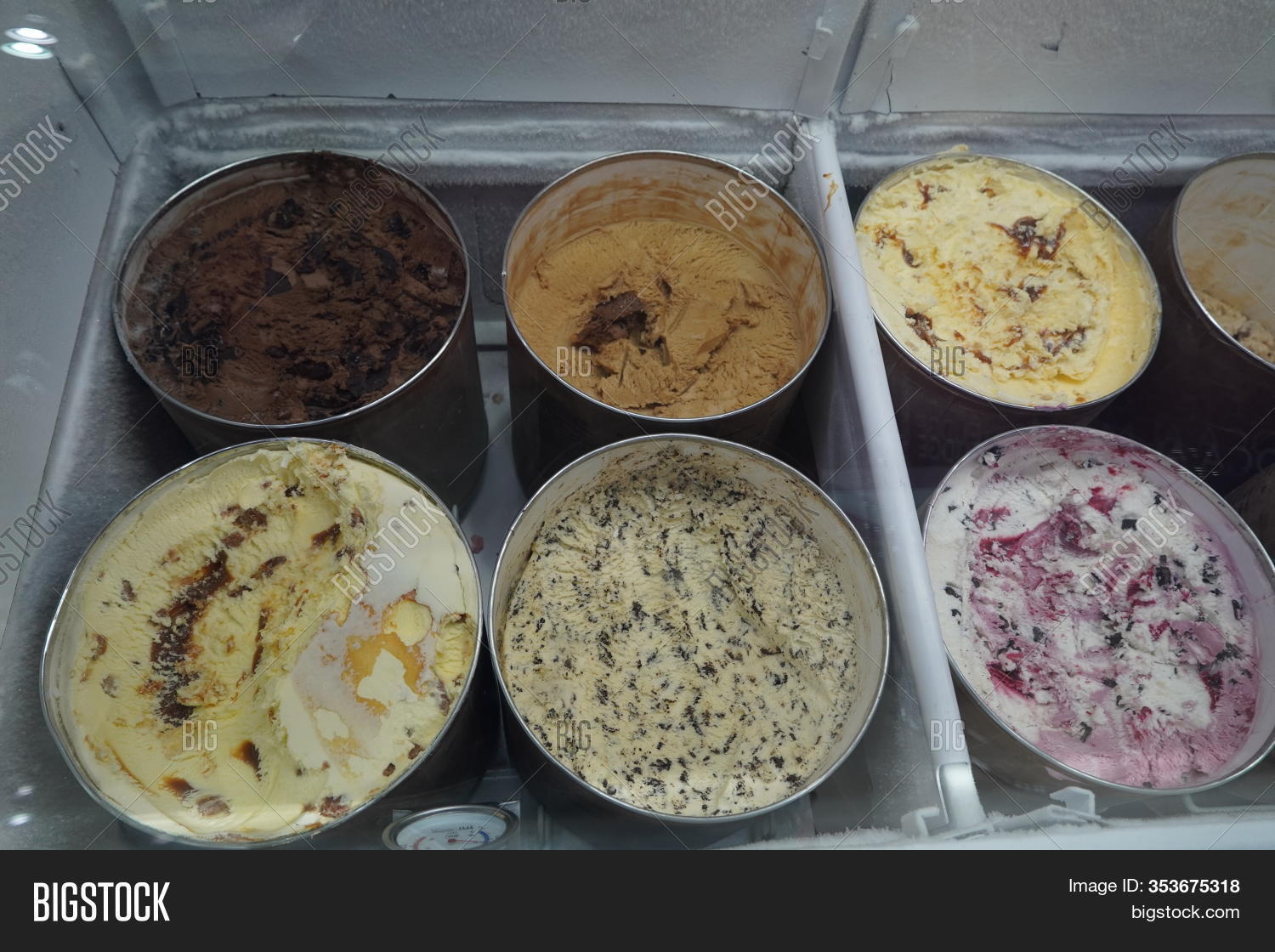 A view of several containers full of popular ice cream toppings on display  at a local ice cream shop. Stock Photo