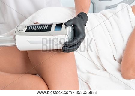Cosmetologist In Rubber Gloves Doing Endospheres Therapy On Female Hips