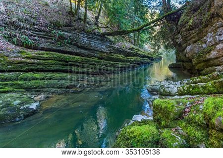 Green And Damp Natural Wild Gorge Of Areuse Stream In Switzerland
