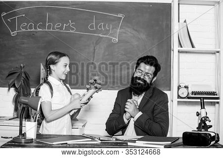 Back To School. Happy Teachers Day. Small School Girl Kid With Flower Bouquet. Teachers Day. Daugght