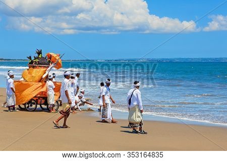 Bali Island, Indonesia - March 18, 2015: Balinese People Procession Walking By Beach With Hindu Scar
