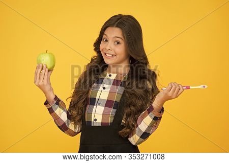 Brush Teeth Right Way. Happy Child Hold Tooth Brush And Green Apple. Teaching Oral Hygiene. Dental H