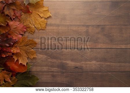 Fall Themed Background On A Wooden Surface