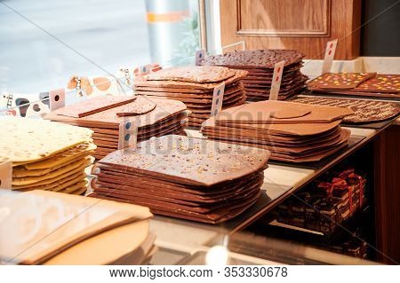 Vienna, Austria - February 19, 2020: Handmade Swiss Chocolate Bars Behind The Store Window Of A Pati