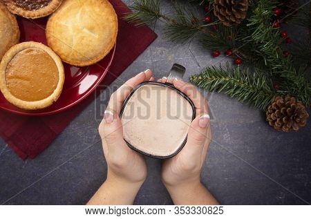 Cup Of Hot Chocolate On A Table Set With Various Pies For The Holidays