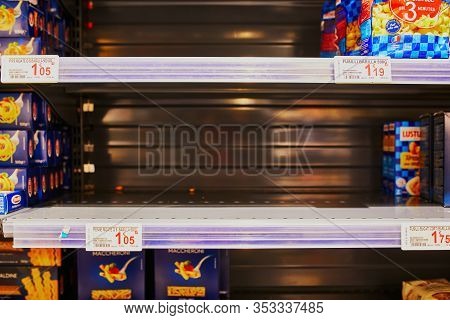 Paris, France - February 29, 2020: Half Empty Shelves At Parisian Supermarket During Outbreak Of Cor