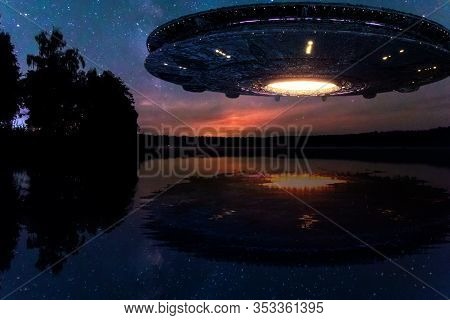 Ufo, An Alien Plate Hovering Above Water, Hovering Motionless In The Air. Unidentified Flying Object