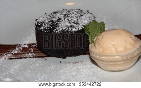 Fondan With Ice Cream On A White Plate. The Most Delicate Dessert Of All Time.