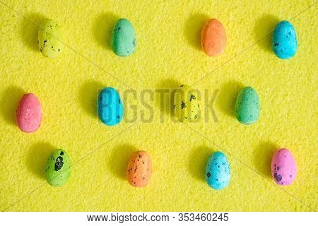 Easter Pattern.bright Beautiful Egg With A Picture For Easter.multi-colored Eggs On A Yellow Fluffy 