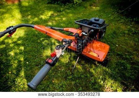 Garden With Tiller Machine. Garden Tiller To Work, Close Up.abstract And Conceptual Of Motor Hoe At 