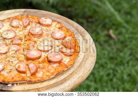 Sausage Pizza On Wood Plate