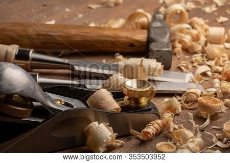 Chisel And Small Block Plane With Wood Shavings