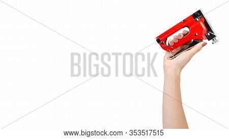 Hand With Red Industrial Stapler, Furniture Industry Hardware. Isolated On White Background. Copy Sp