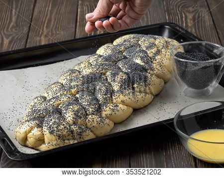 Oiled Braided Bread ( Challah Bread) For Baking Sprinkled With Poppy Seeds. Located On A Baking Shee