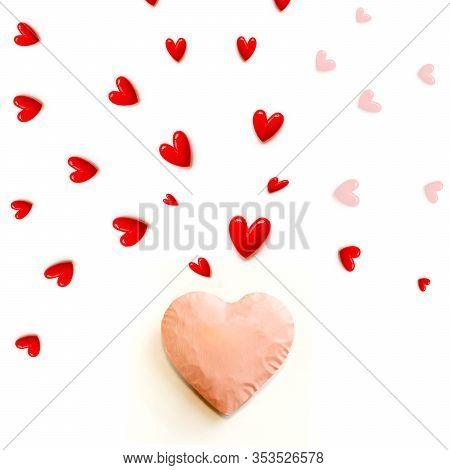 The Red Small Hearts Overflow Around The Pink Heart, And Fly Upwind.and Pink Background And Copy Spa