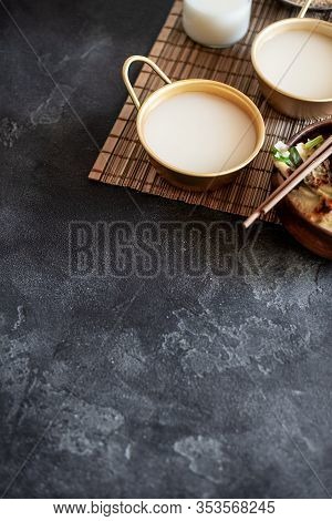 Makgeolli Rice Wine Is One Of The Oldest Korean Traditional Fermented Alcoholic Drinks On Dark Backg