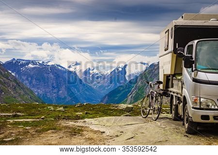 Mountains Landscape And Camper Car With Bicycle On National Tourist Scenic Route Gamle Strynefjellsv
