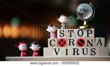 Concept Coronavirus. Prevent Or Stop The Spread Of The Covic-19 Worldwide. Letters On The Wooden Flo