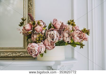 Beautiful Beige Purple Violet Pink Flowers Near The White Wall And Mirrow