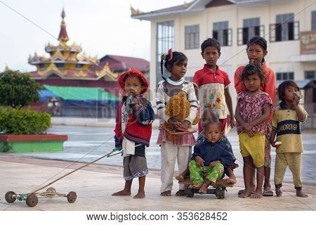 Nyaungshwe Inle Lake, Burma - December 4, 2012. Portrait Of Burman Children Different Age In Colorfu