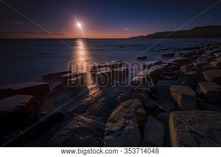 The Sky Clears After A Rain Storm Just Long Enough To Show The Deep Red And Purple Clouds Over The S