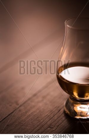 Close Up Shot Of A Glencairn Whisky Glass, With Copyspace To The Left.