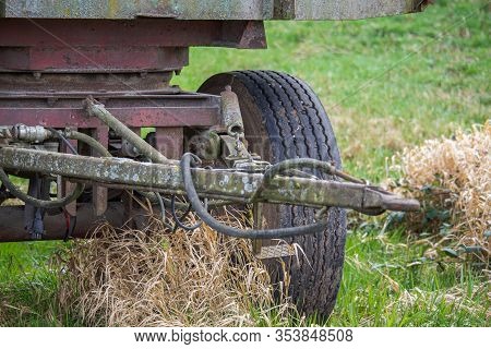 Spring Of A Trailer Drawbar Full Of Moss, Spores And Rust