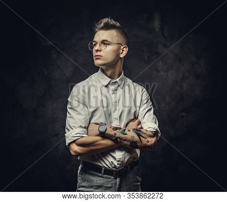 Young, Modern Student Guy In A White Shirt, With Tattoos On His Hand, Wearing Glasses And Watches, P