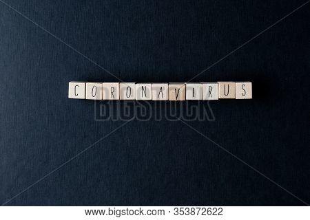 Coronavirus Spelled On Wooden Cubes With Medical Pills And Tissue Papers For Convid-19 Virus, Top Vi