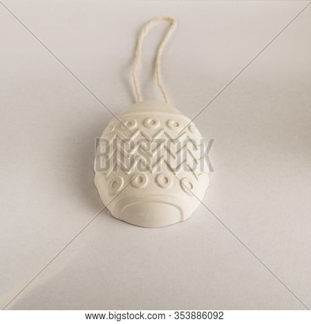 White Easter Egg. Gypsum Medallion Casting. Plaster Product For Coloring On A Rope